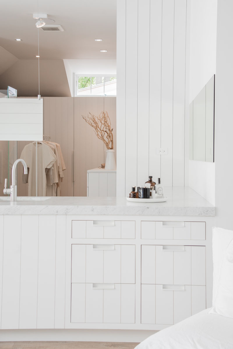 modern master bathroom and closet white vanity 071019 805 03