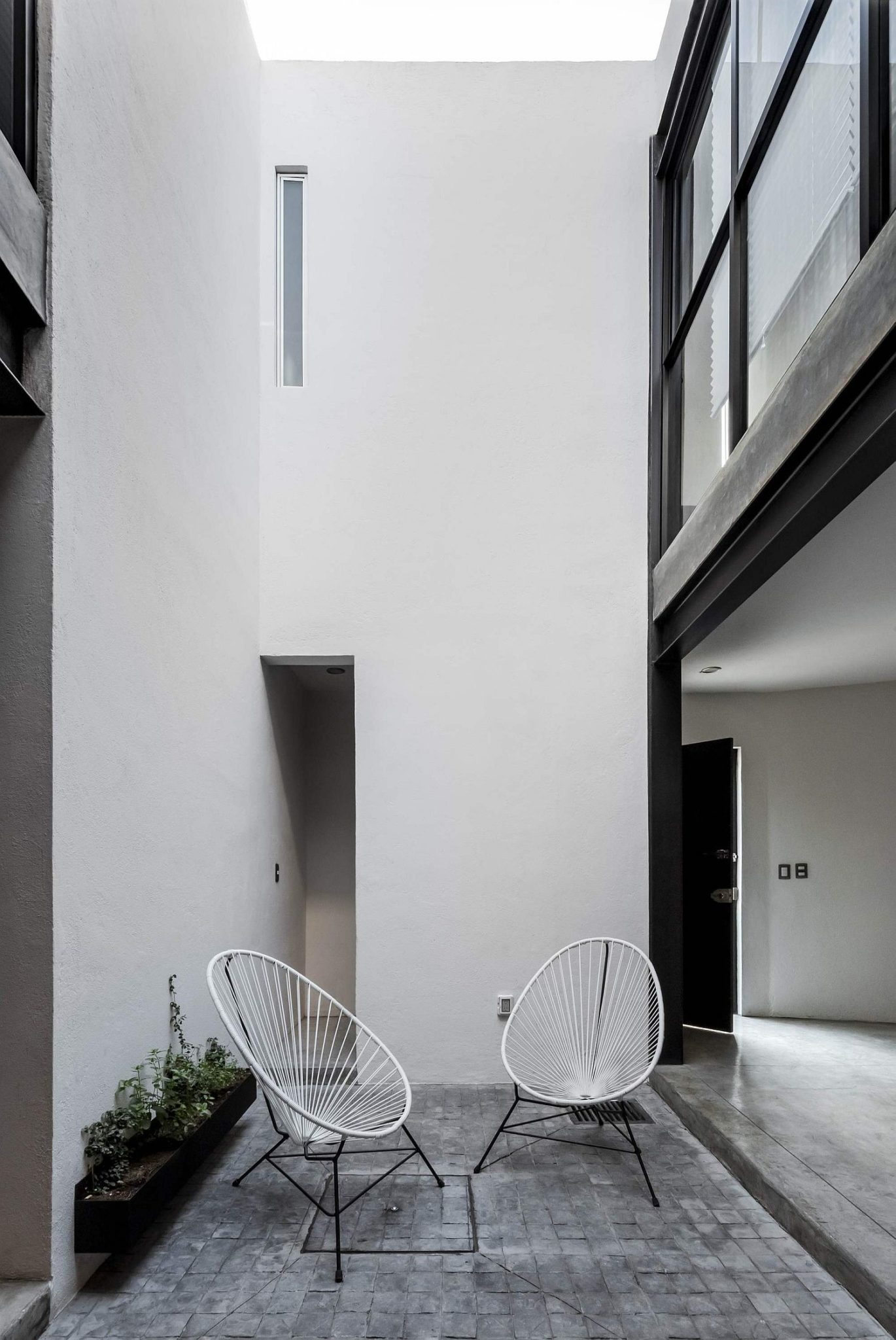 Open central courtyard of the industrial modern home