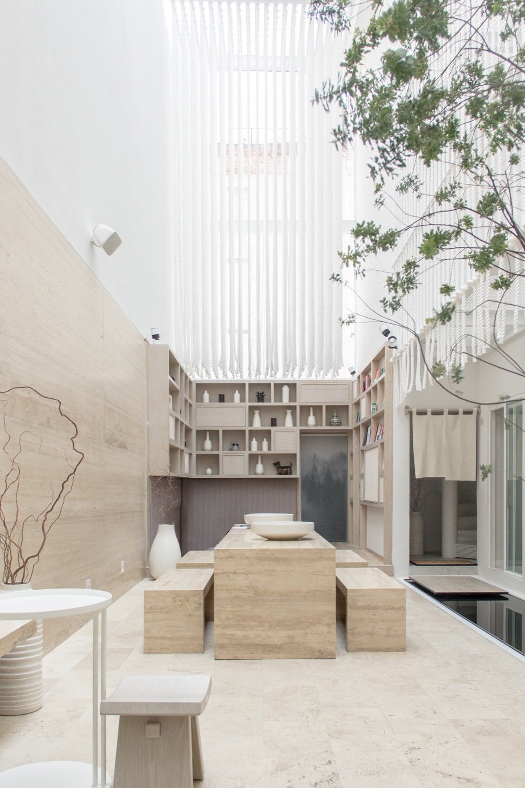 the light filled welcome area features an open library seating and a zen garden